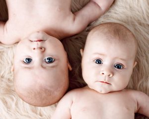 twin babies laying down